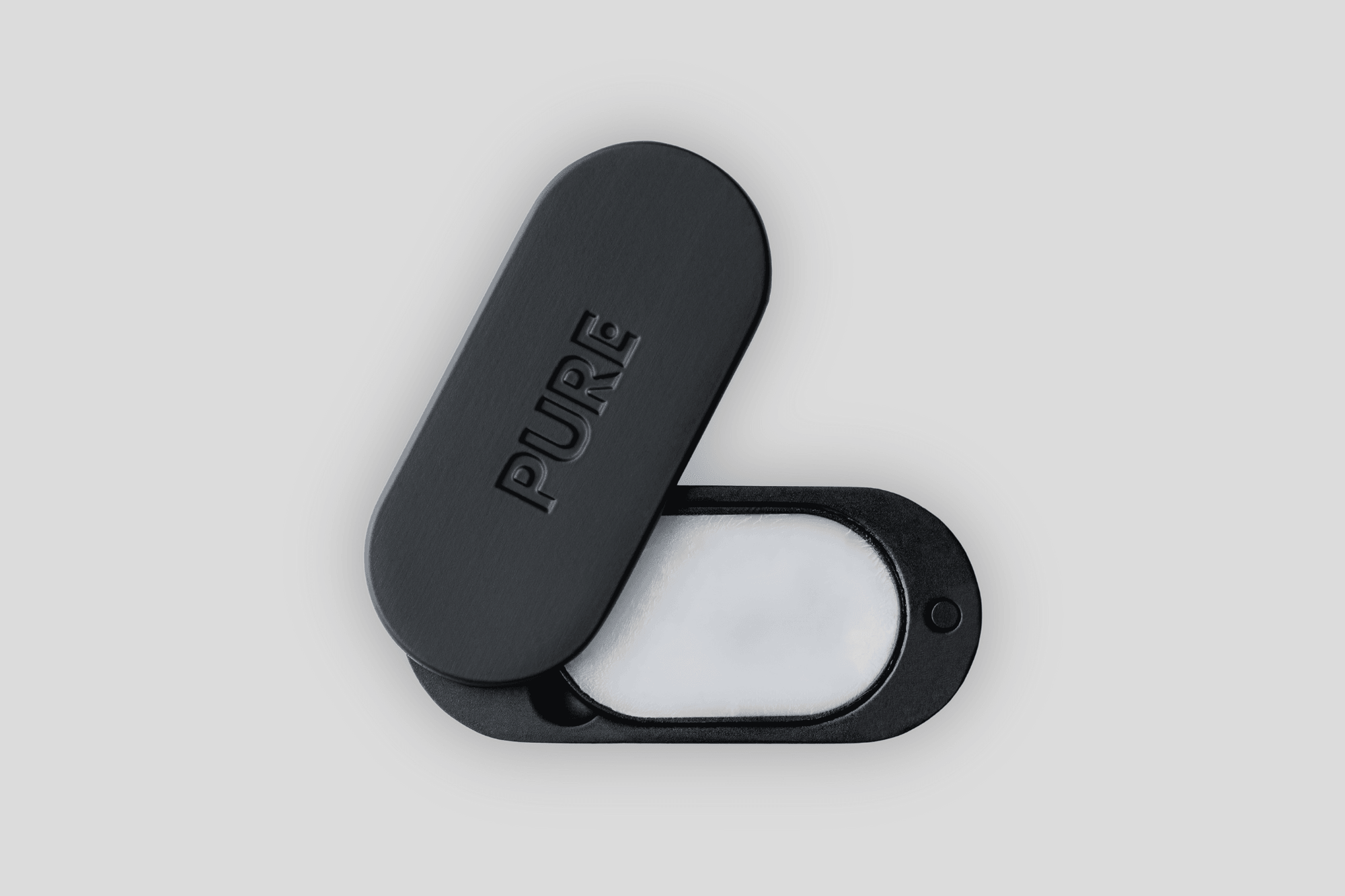 a opened black PURE solid perfume box